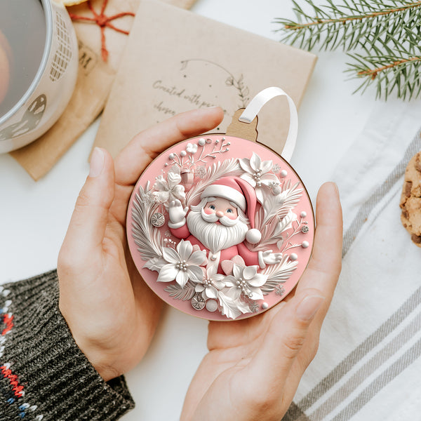 Rózsaszín karácsonyfadísz integető Mikulással